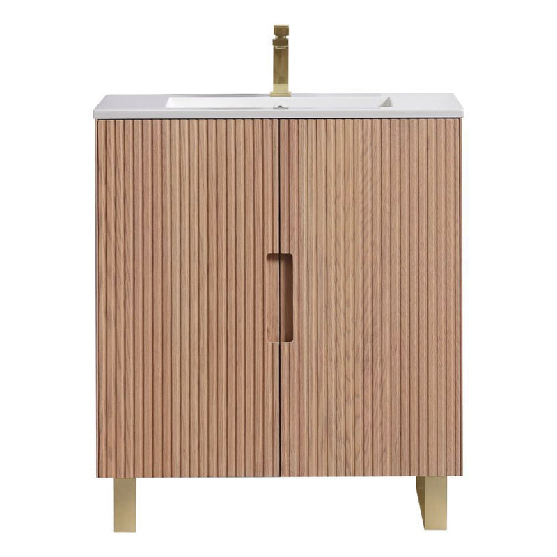 Wooden fluted bathroom vanity with white countertop and faucet on a white background