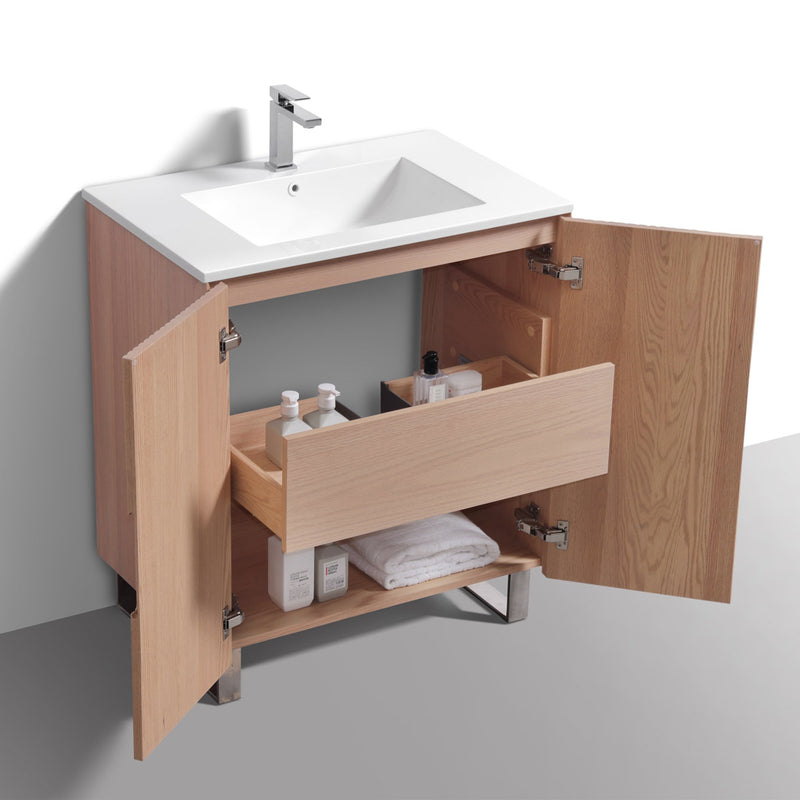 Fluted bathroom vanity with open cabinet doors showing toiletries on a neutral background