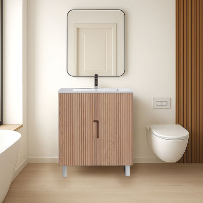 Fluted wooden vanity, mirror, and toilet against a beige wall.