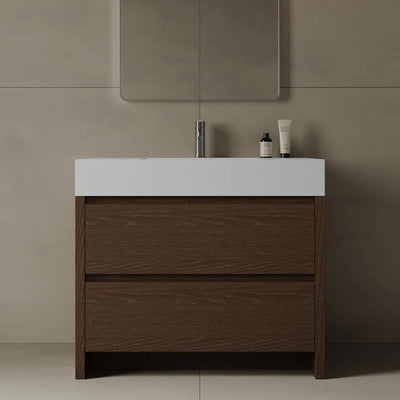 Bathroom vanity with white countertop and wooden cabinet against a beige wall.