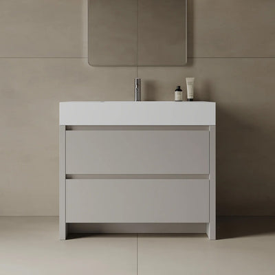 Bathroom vanity with a mirror and toiletries on a beige wall.