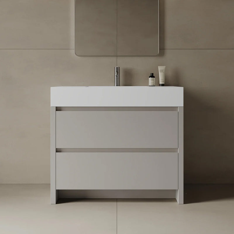 Bathroom vanity with a mirror and toiletries on a beige wall.