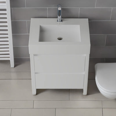 White vanity unit with sink in a bathroom setting