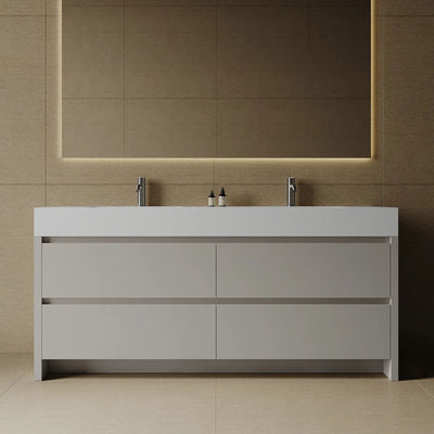 Bathroom vanity with two sinks and a large mirror in a tiled bathroom.