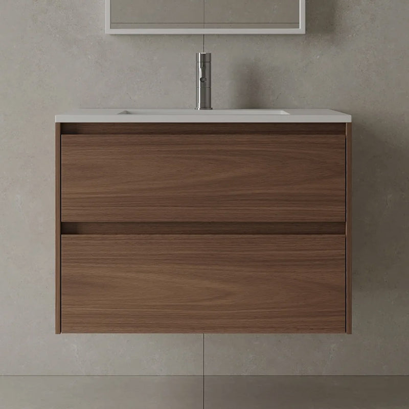 Wooden bathroom vanity in a walnut finish with a white acrylic sink top