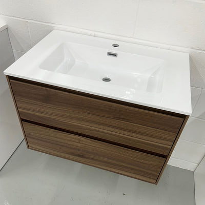 Bathroom vanity with wooden cabinet and white countertop