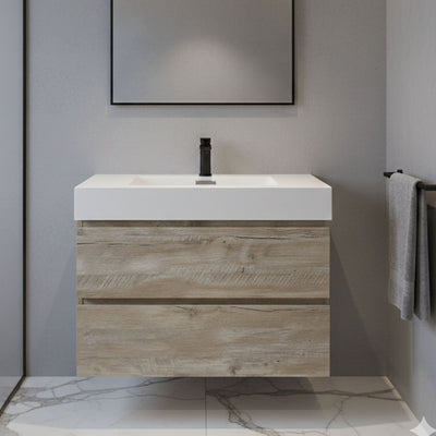 Bathroom vanity with wooden finish and white countertop against a gray wall.