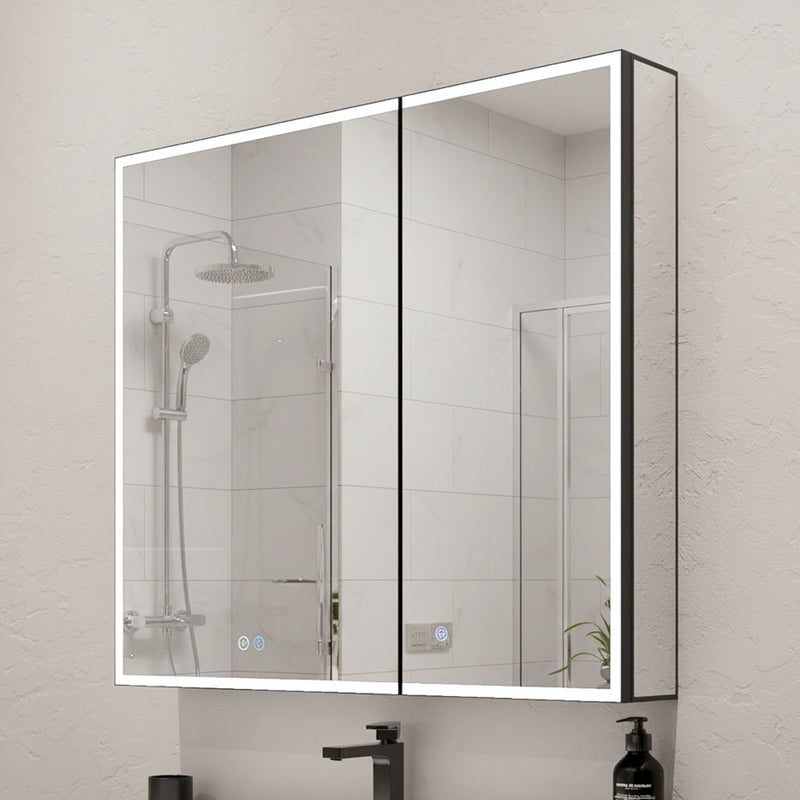 Bathroom mirrored cabinet  with LED lighting and control buttons, mounted on a tiled wall.